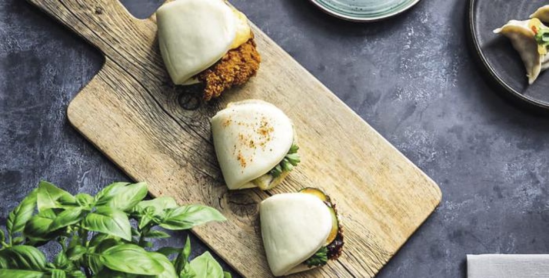 Bao buns on a wooden chopping board