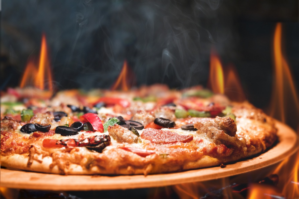Pizza with fire around the outside