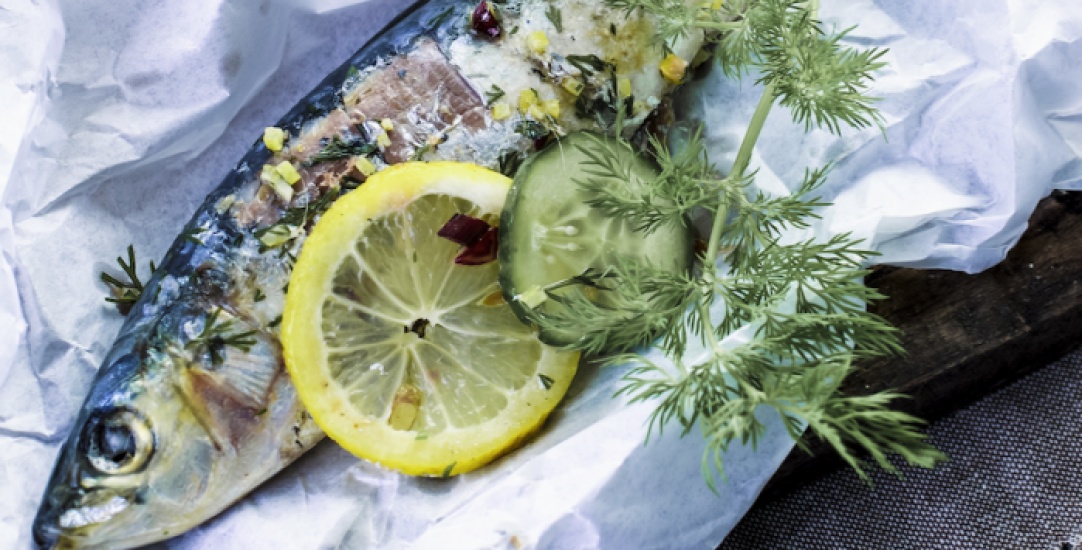 A fish with lemon and cucumber dressing