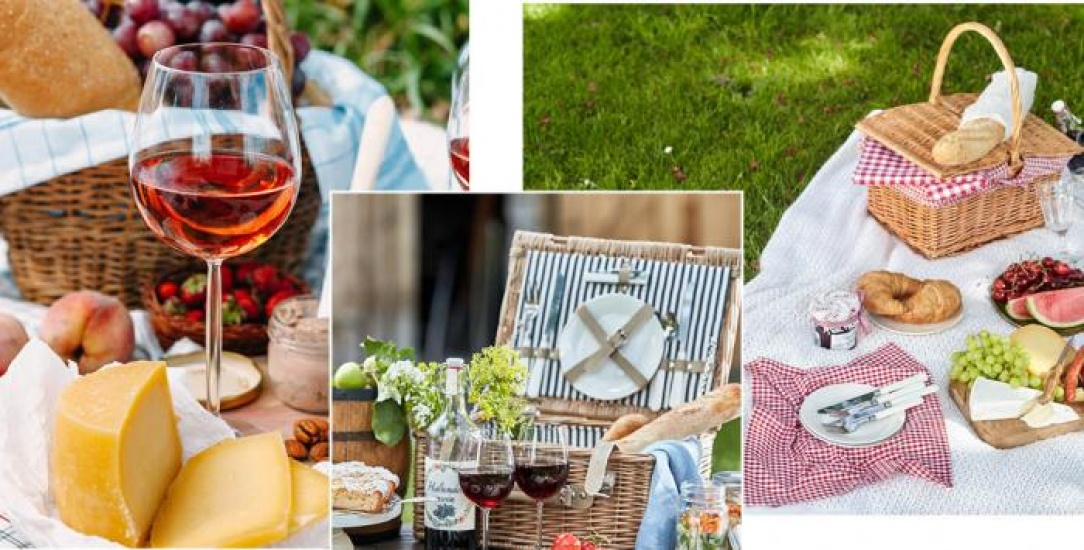 Picnic set up with basket, wine and cheese