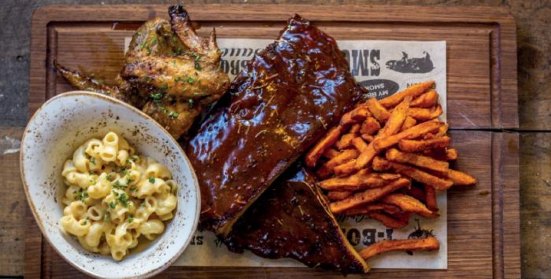 Steak dinner with Mac and Cheese, chicken wings and sweet potato fries