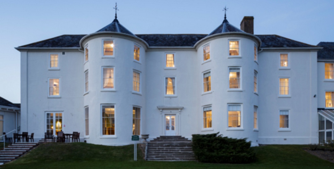 Tall white hotel building called Tewkesbury Park Hotel