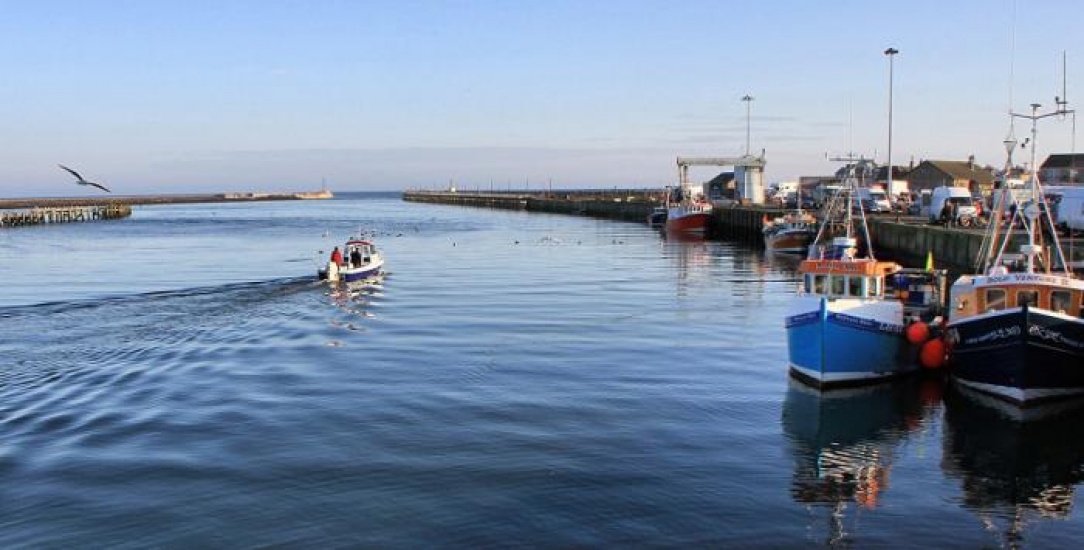 fishing boats and river running to the sea