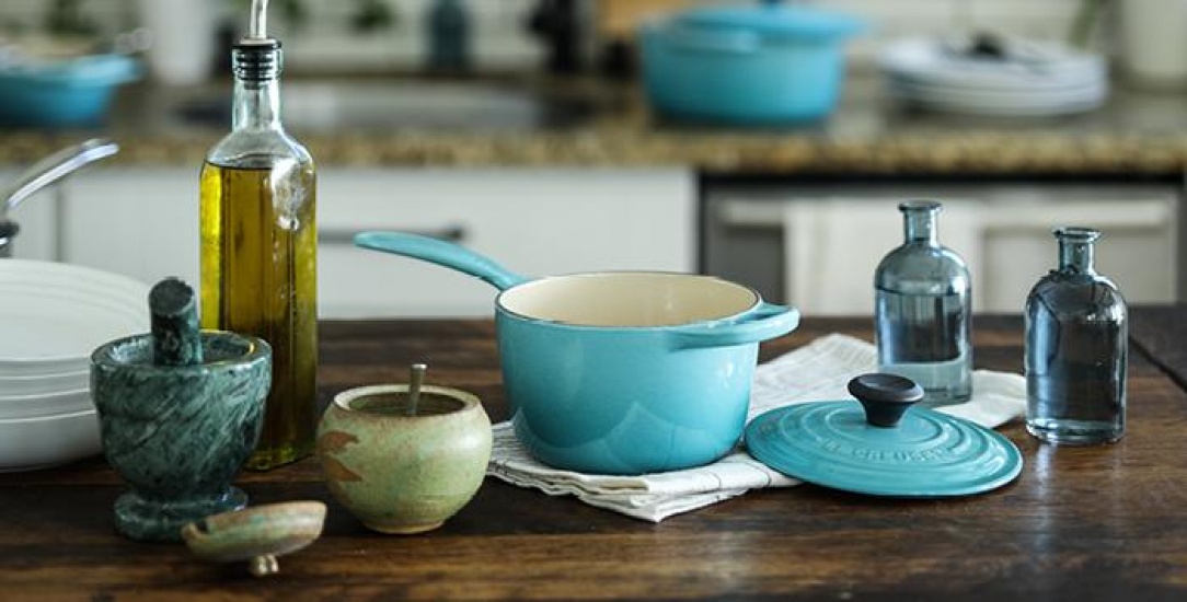 A pestle and mortar a pan and some olive oil