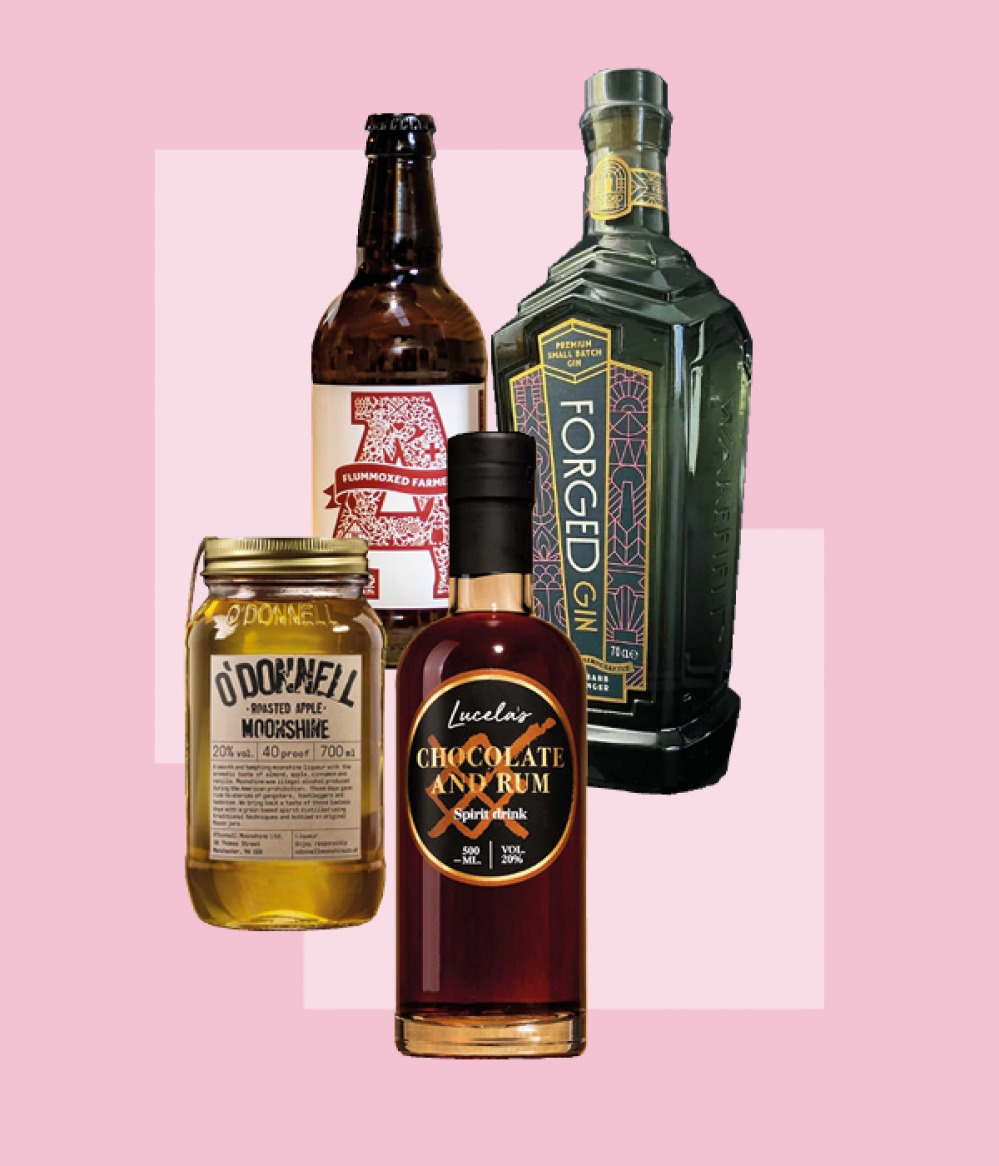 bottles of alcohol on pink background