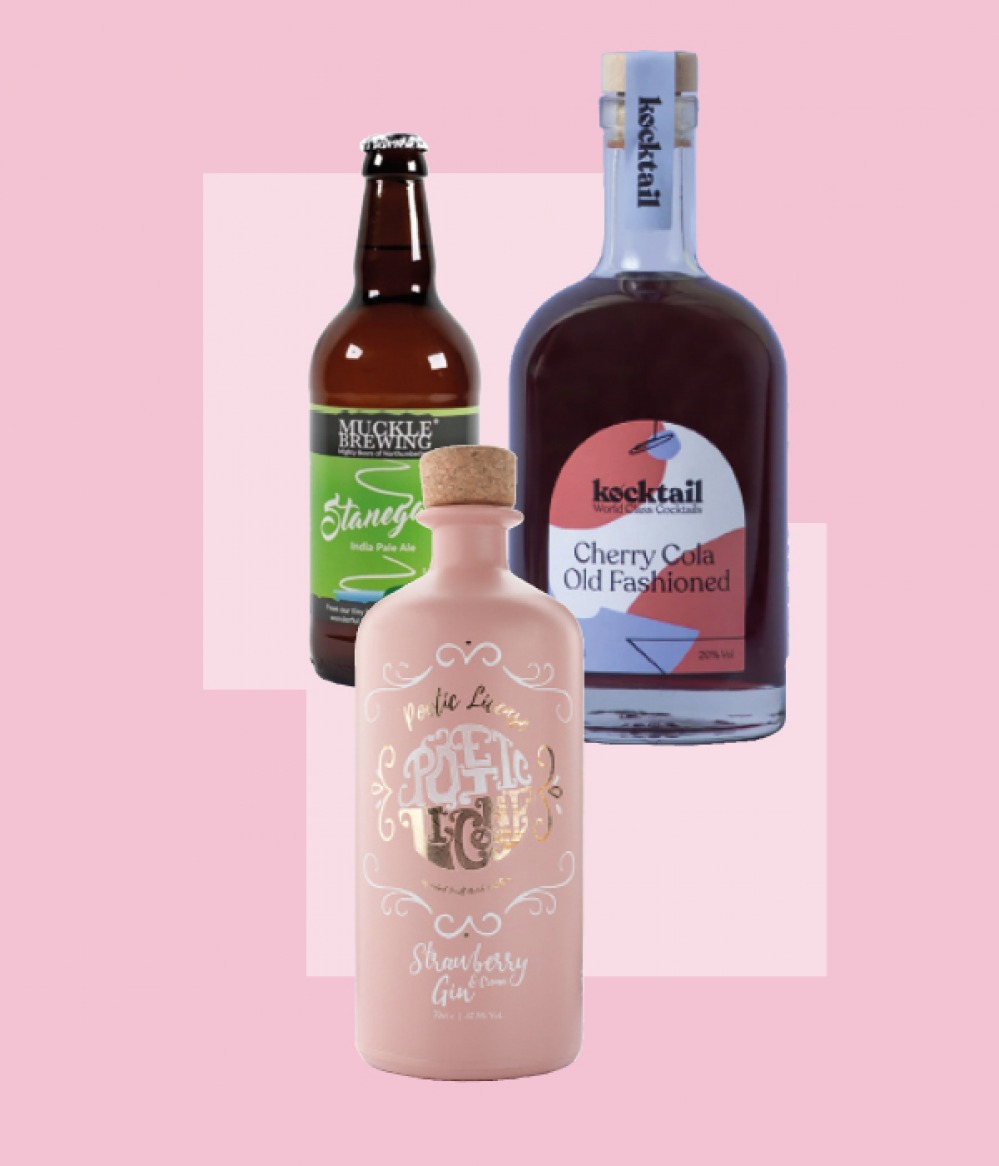bottles of alcohol on pink background