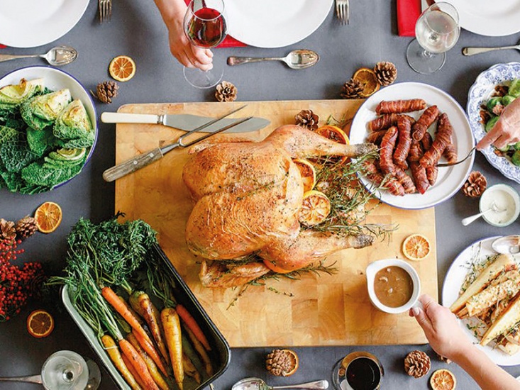 Roast turkey centre piece with vegetables and pigs in blankets