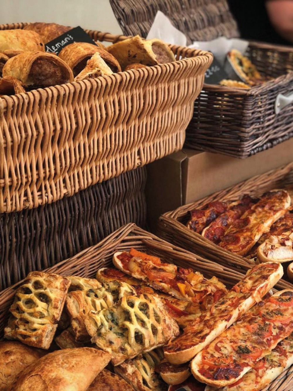 Pies, pastas and pizzas in wicker baskets