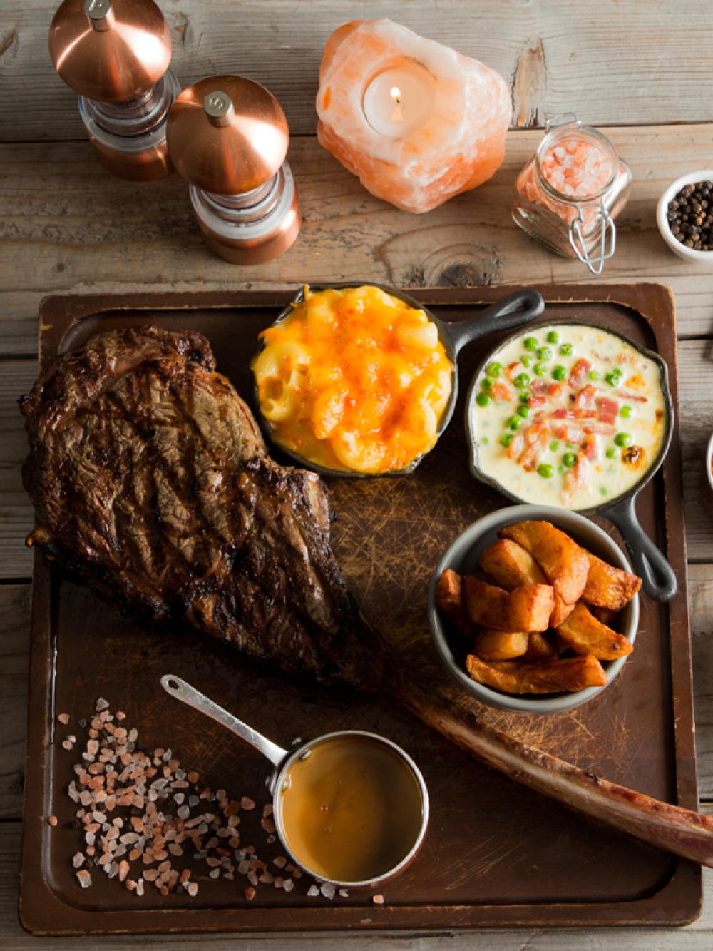 large piece of cooked meat with sides