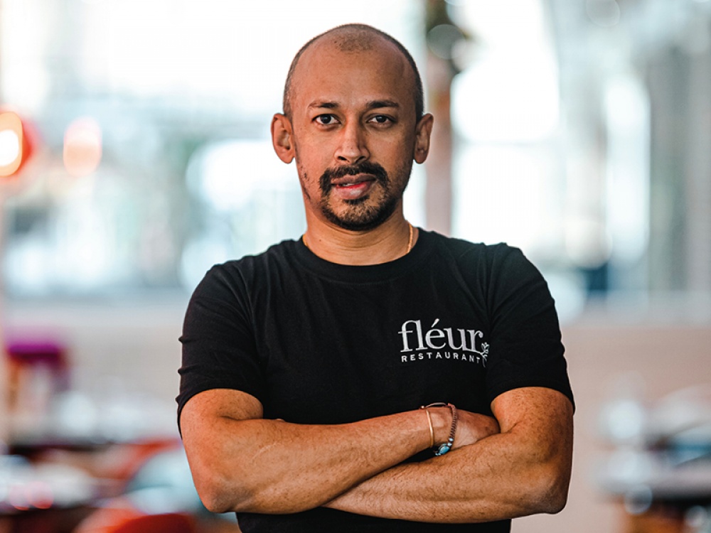 a chef smiling at a camera