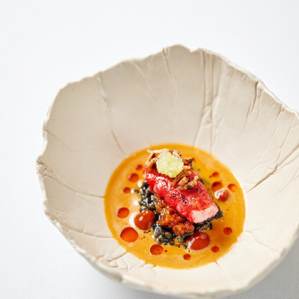 Food served in a white sculpted bowl at The Box Tree