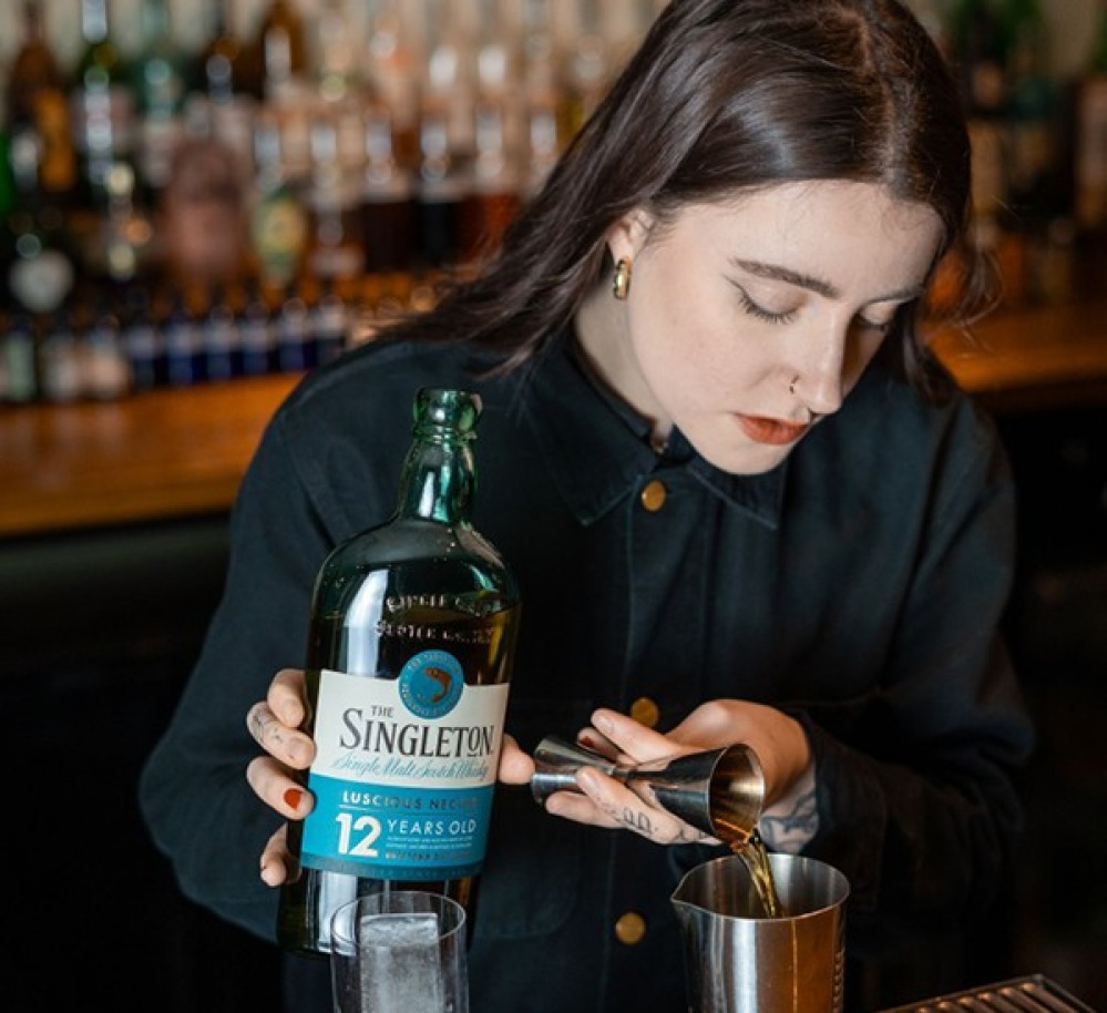 Lottie making a cocktail