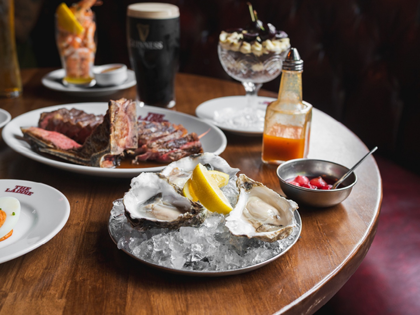 Oysters on ice, prawn cocktail, pint of Guinness, dessert, condiments