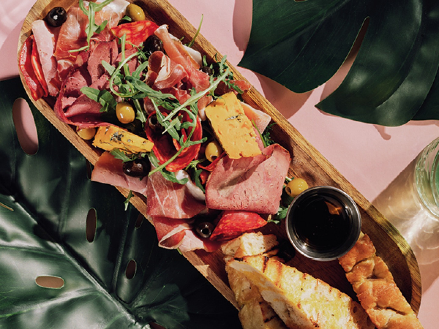long bowl with meats cheeses and bread