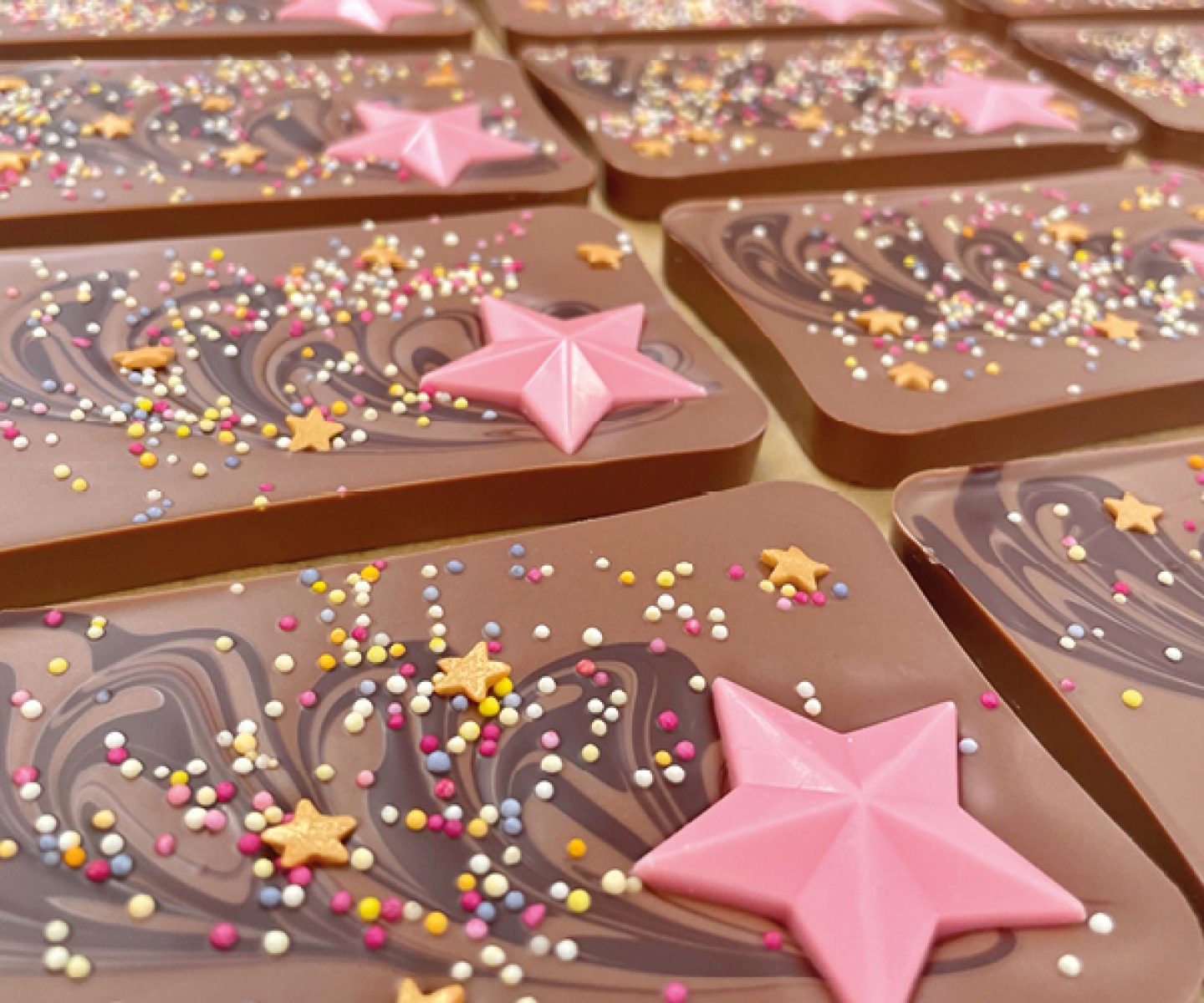chocolate bars with pink star and sprinkles