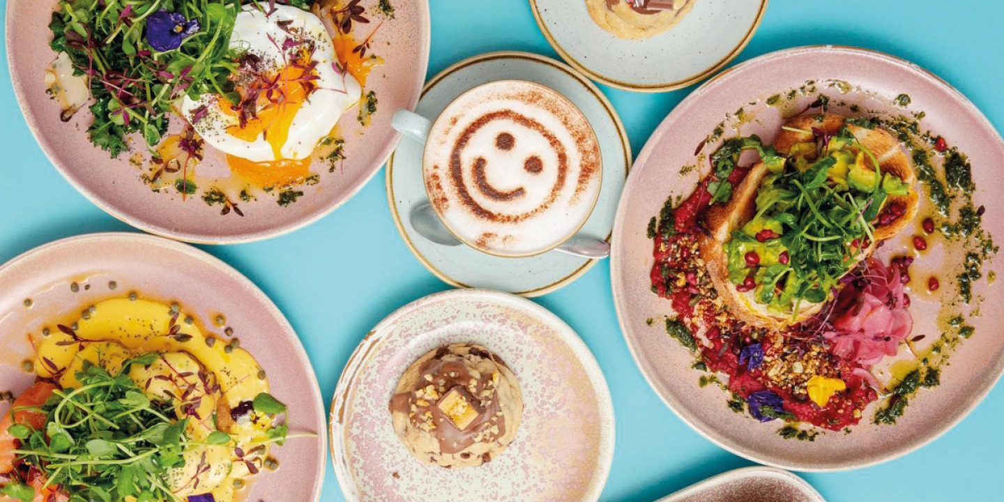 Ariel view of a coffee and different food dishes