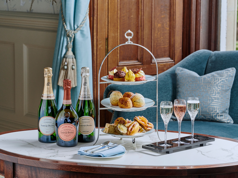 Afternoon tea with champagne bottles