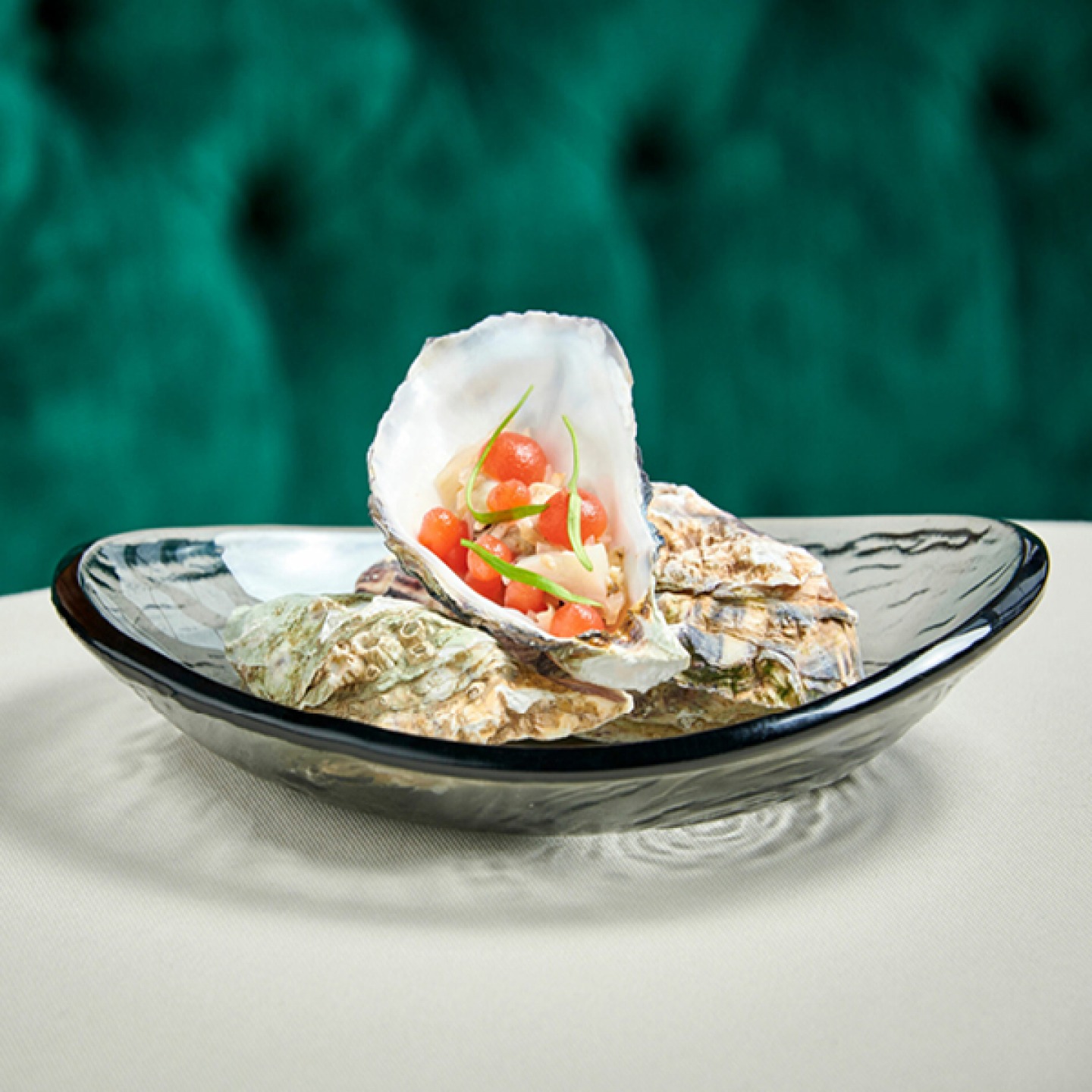 Oysters with melon balls and garnish
