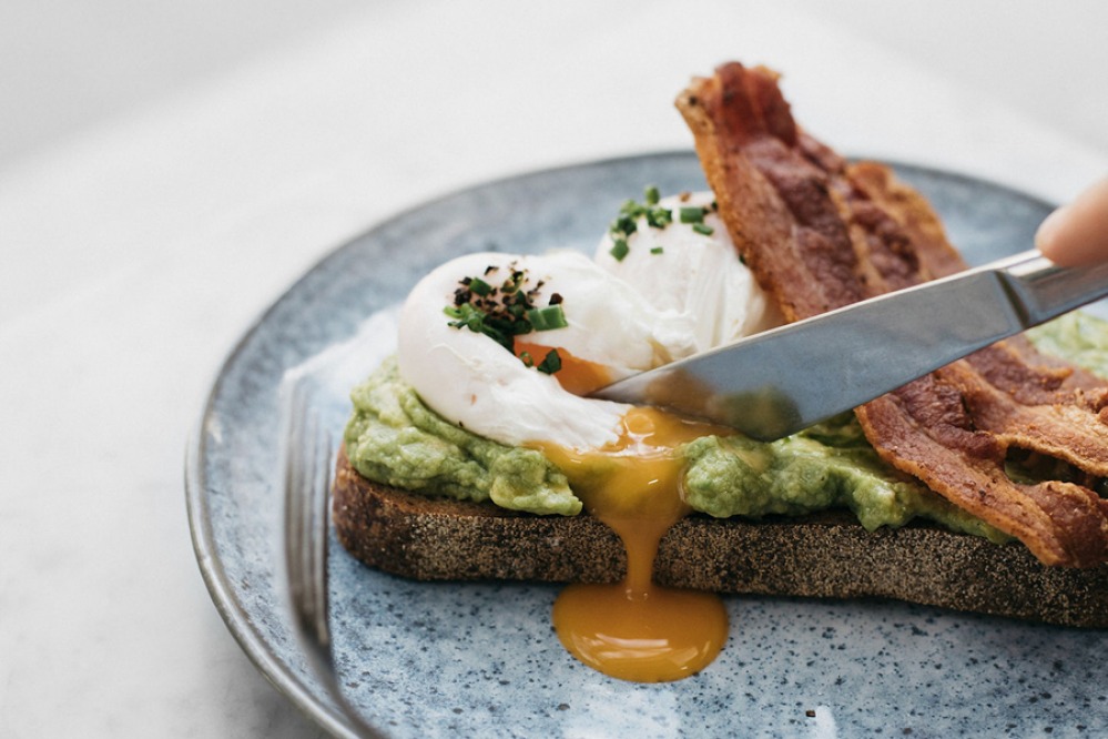 Avocado, eggs, bacon on toast