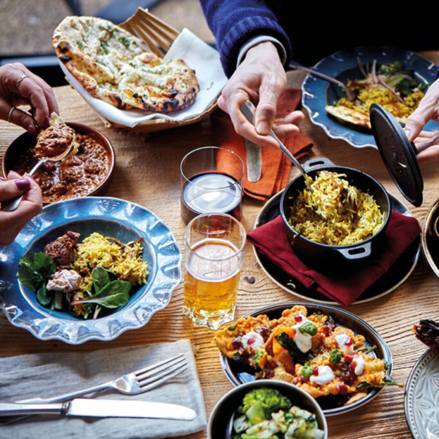 Customers eating Indian dishes