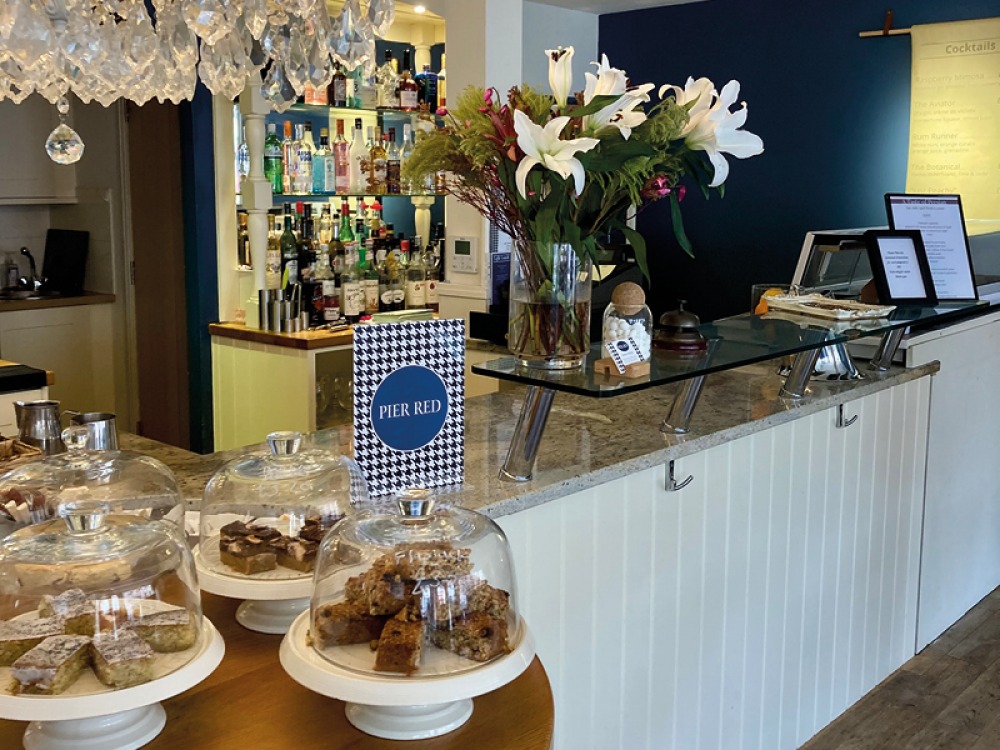 Cakes and baked goods at the counter of Pier Red Lounge & Kitchen