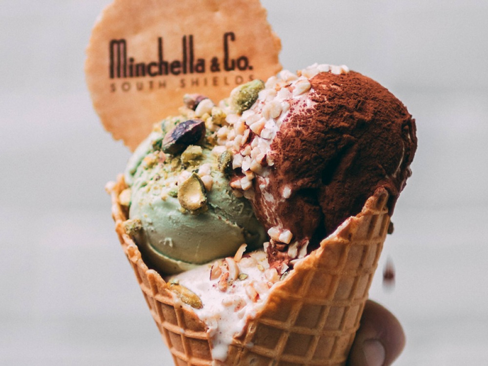 waffle cone with 3 scoops and a wafer