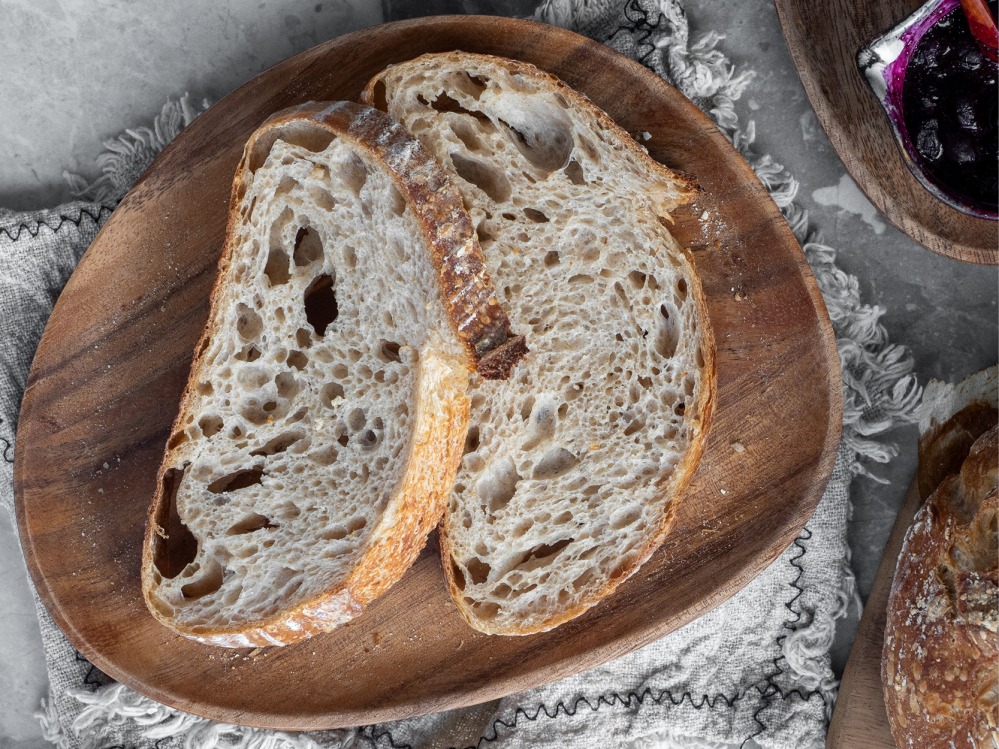 cut bread on a wooden plate