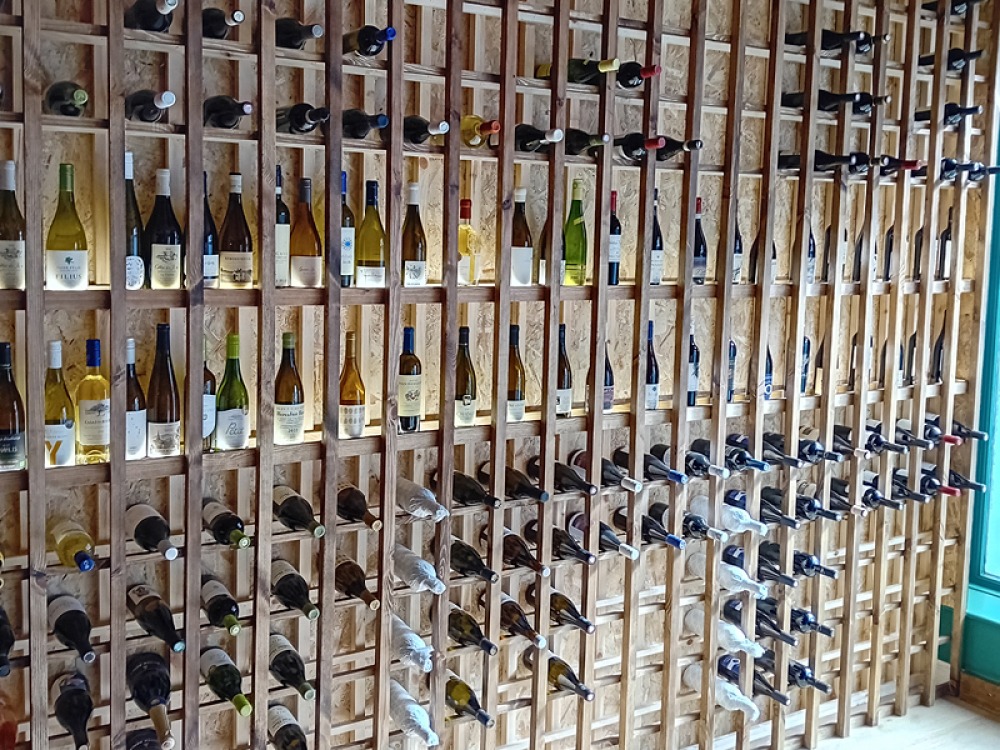 floor to ceiling wine rack full of bottles