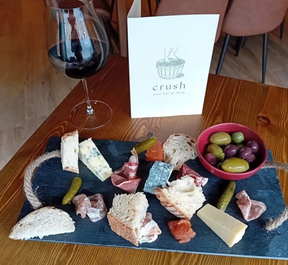 Cheese board and glass of red wine