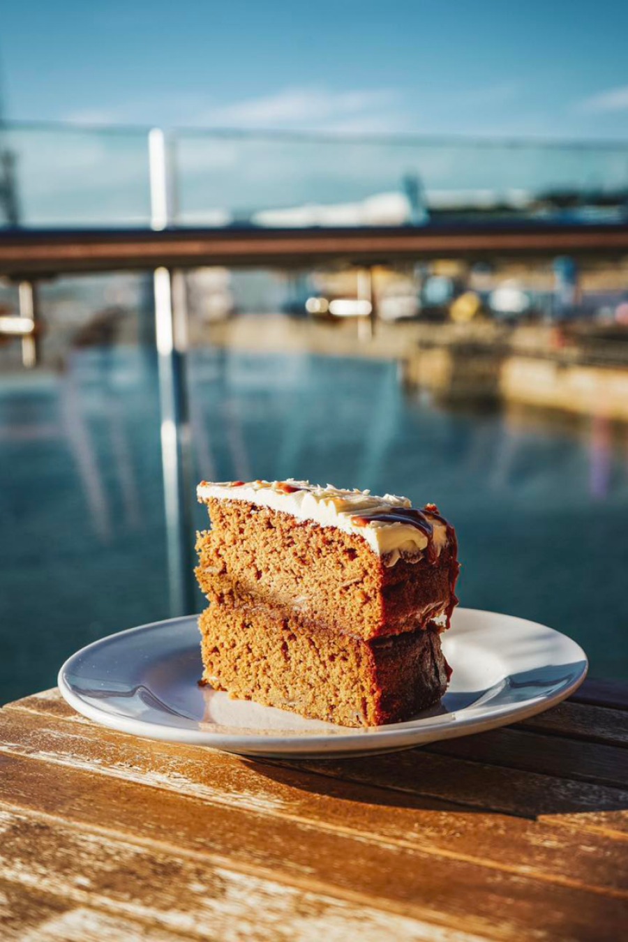 slice of cake in front of sea