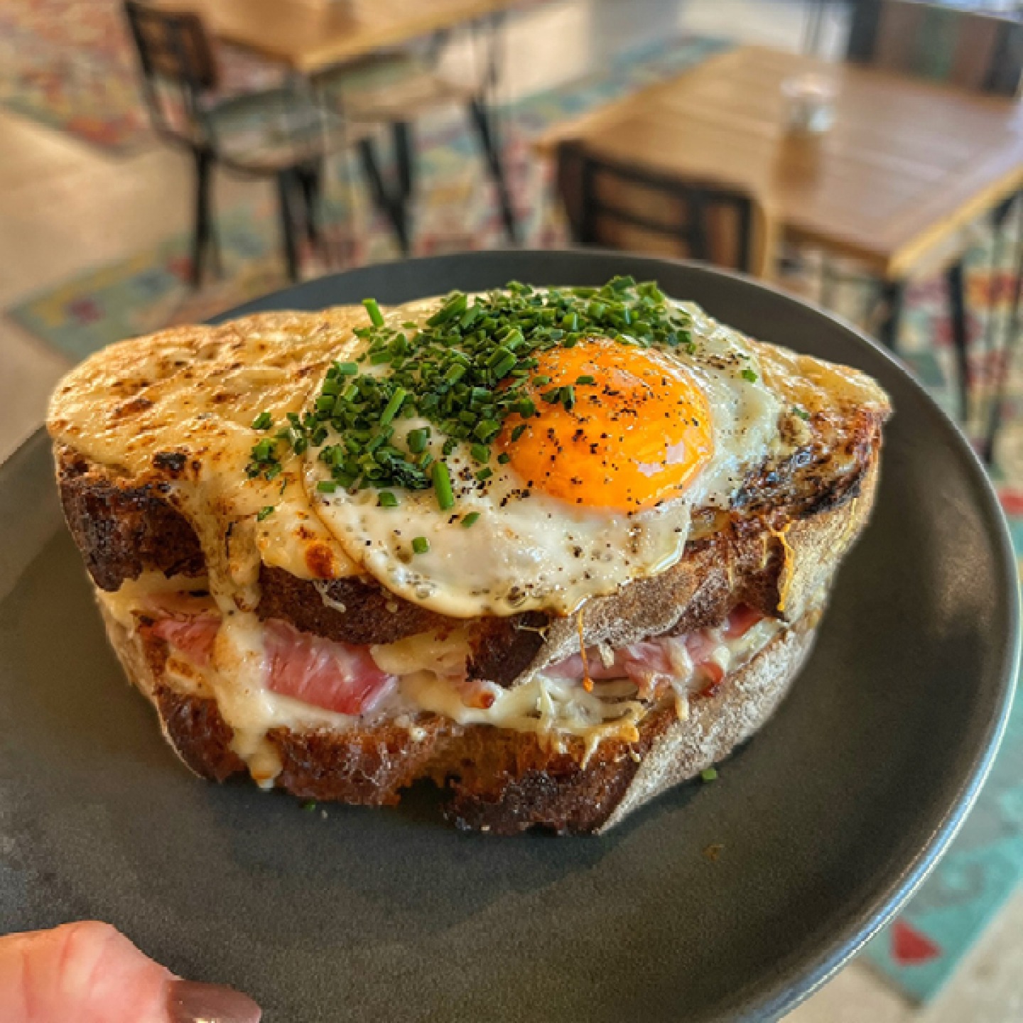 cheesy bacon and egg topped toasted sandwich