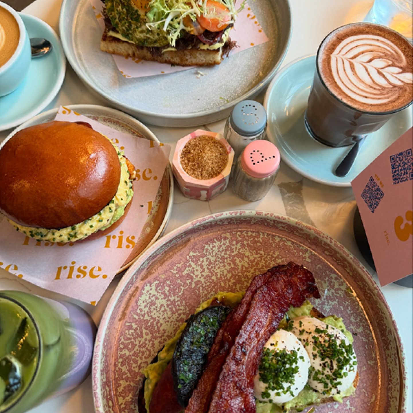 Brunch food with coffees and pastel athletics