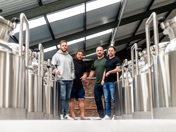 4 men in a brewery