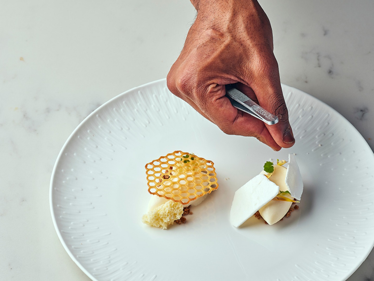 chef making up a plate of food