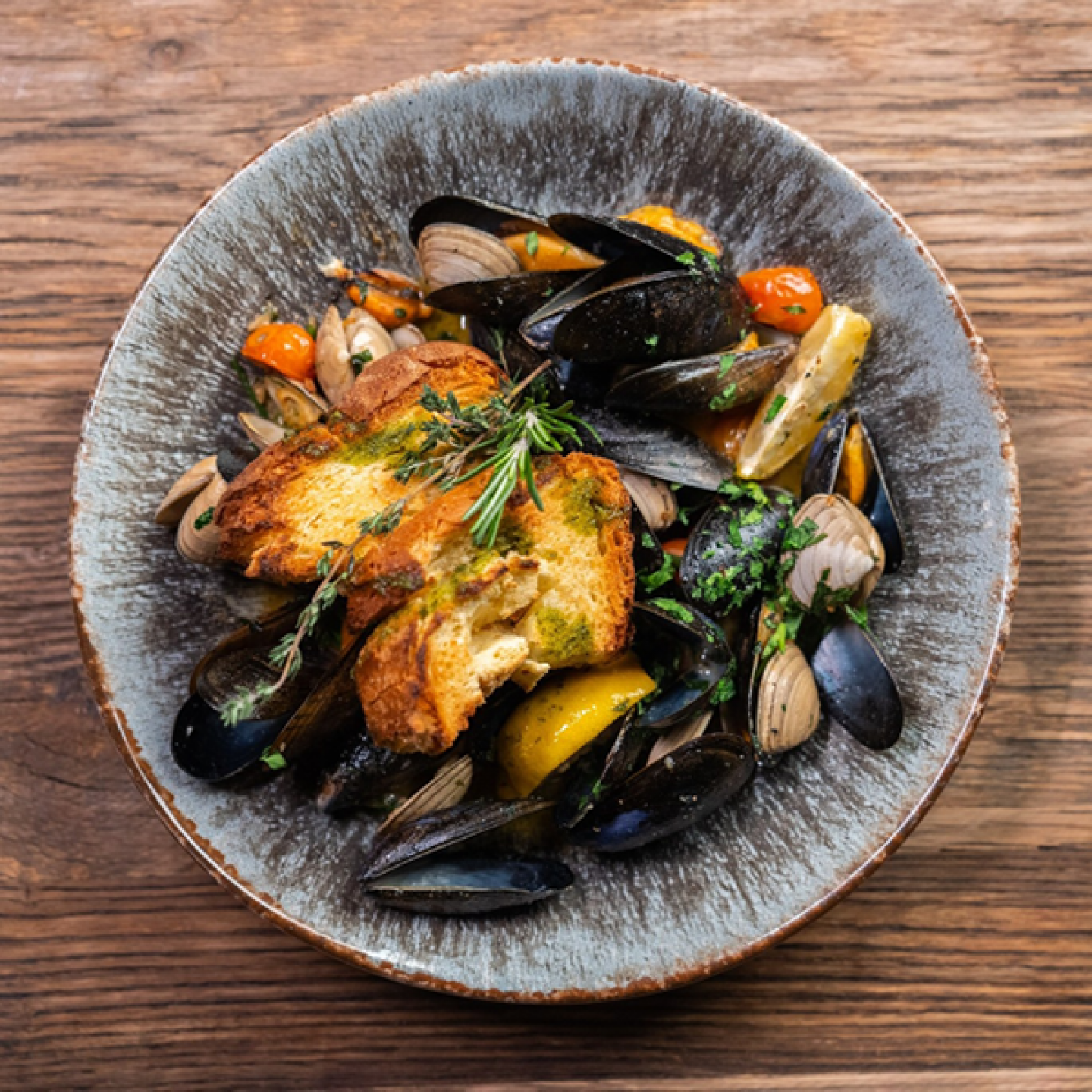 bowl of mussels cooked in chilli oil