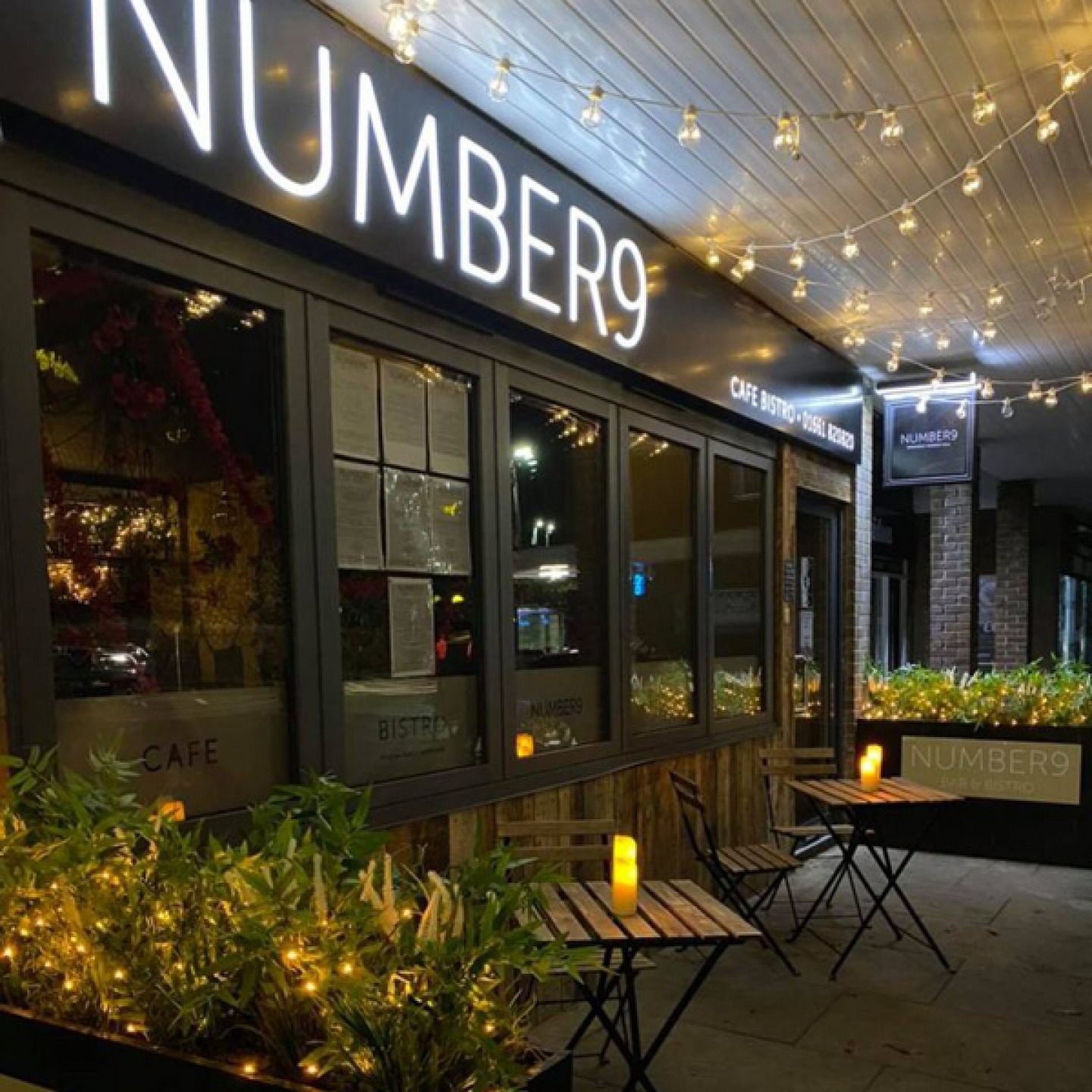 fairy lights and outdoor tables