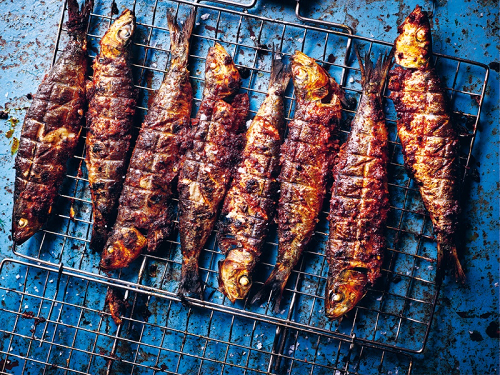 Cooked curried fish on a mesh rack
