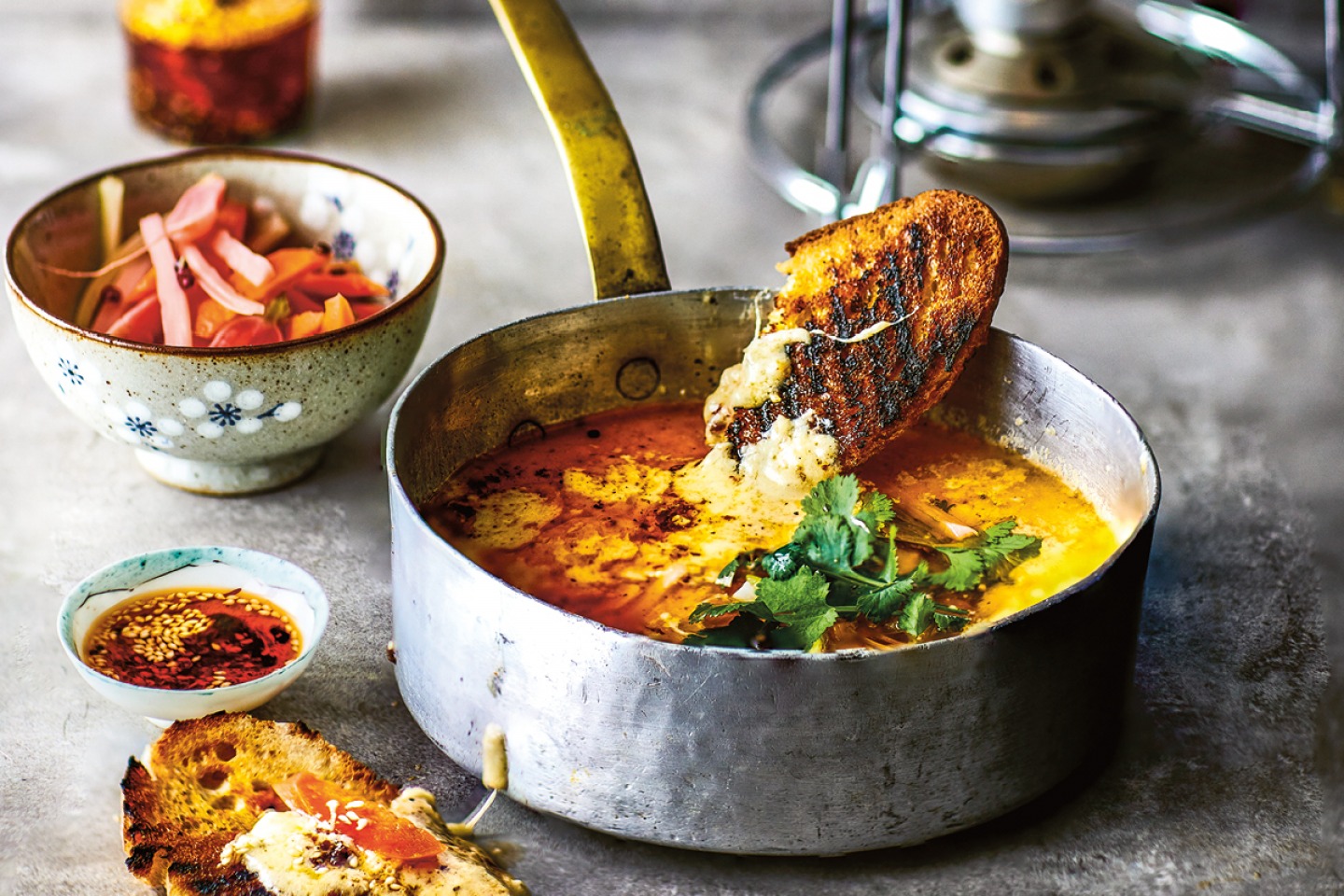 silver pan full of melted cheese and toast