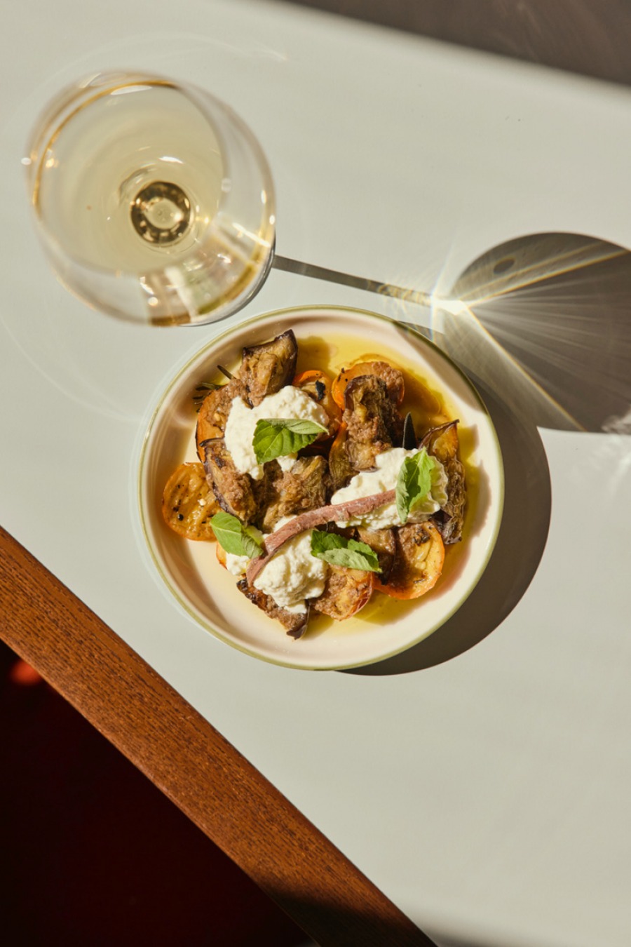 Marinated Aubergine Dish with a glasss of white wine