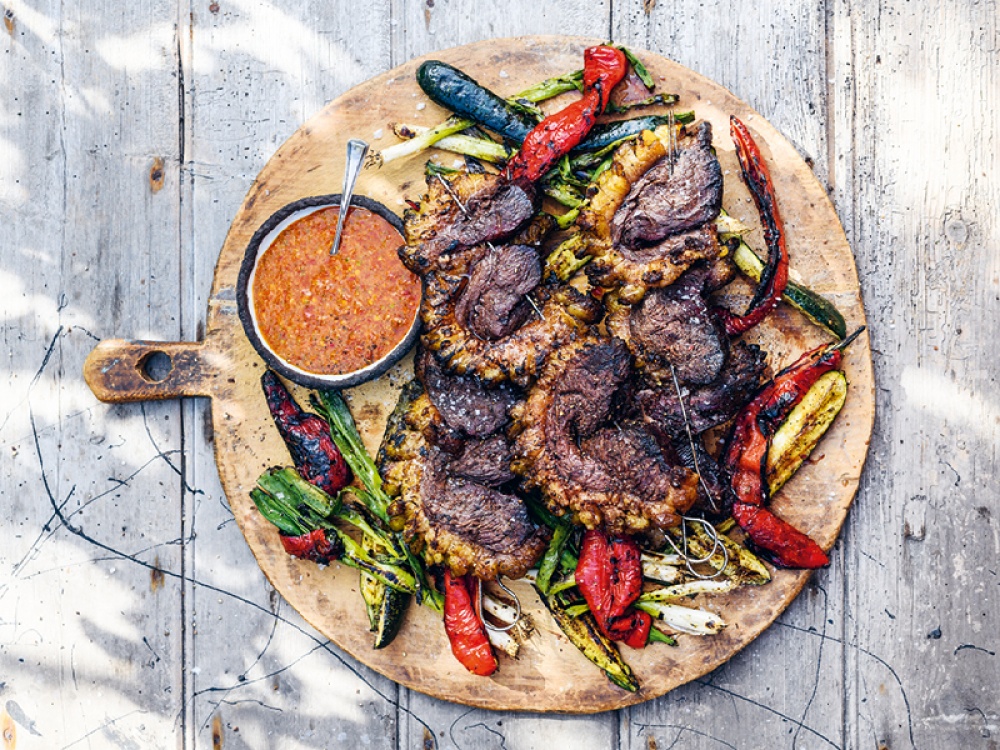circular board of barbecued meet and veg