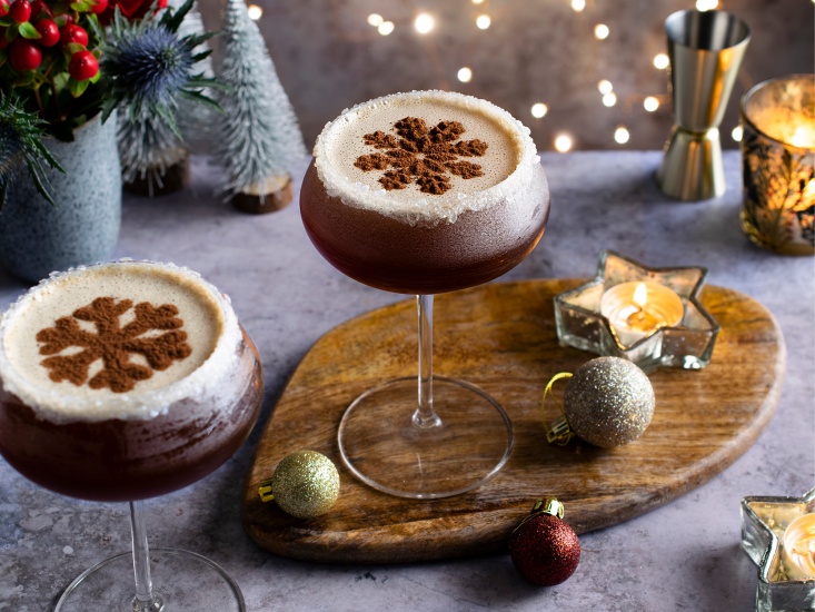 cocktail in martini glass with a chocolate shaped as a snowflake