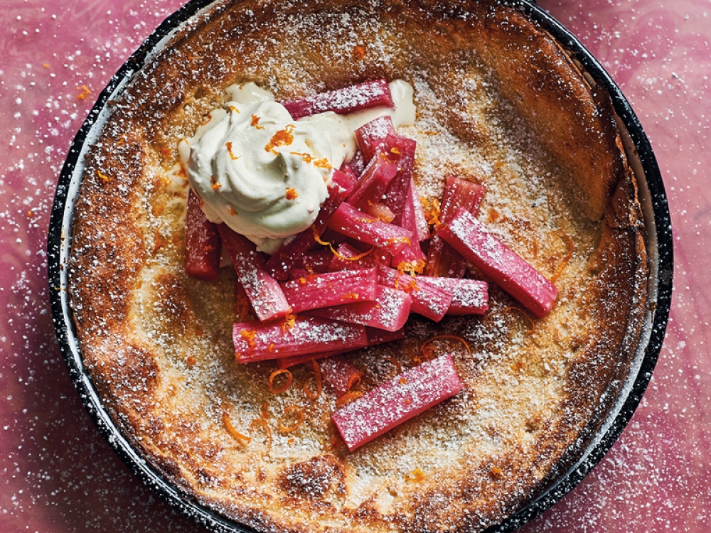 pancakes with rhubarb and cream on the top