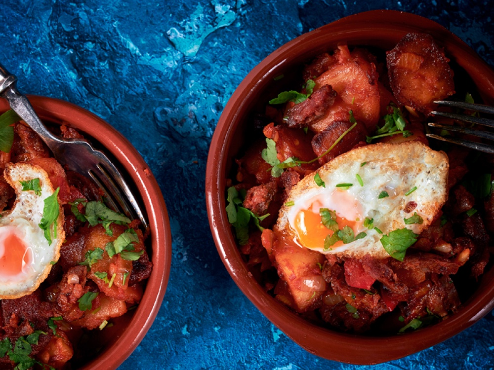Potatoes with Spicy Chorizo, Red Pepper & Tomato, Garnished with a Fried Egg