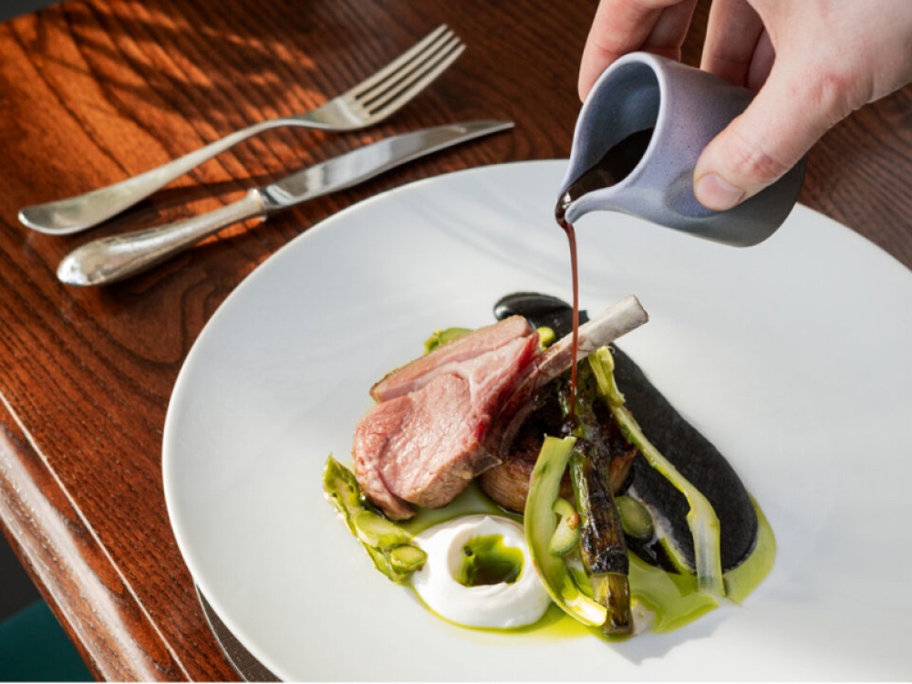 Lamb chop served with green vegetables