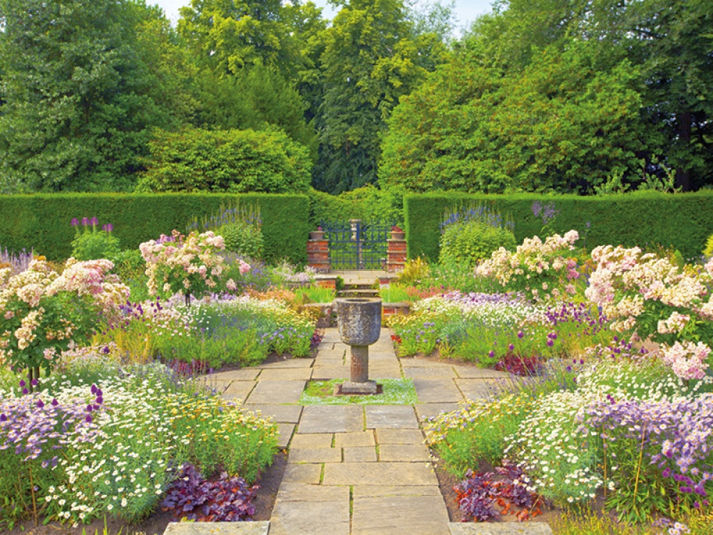 garden walkway with flowers all around