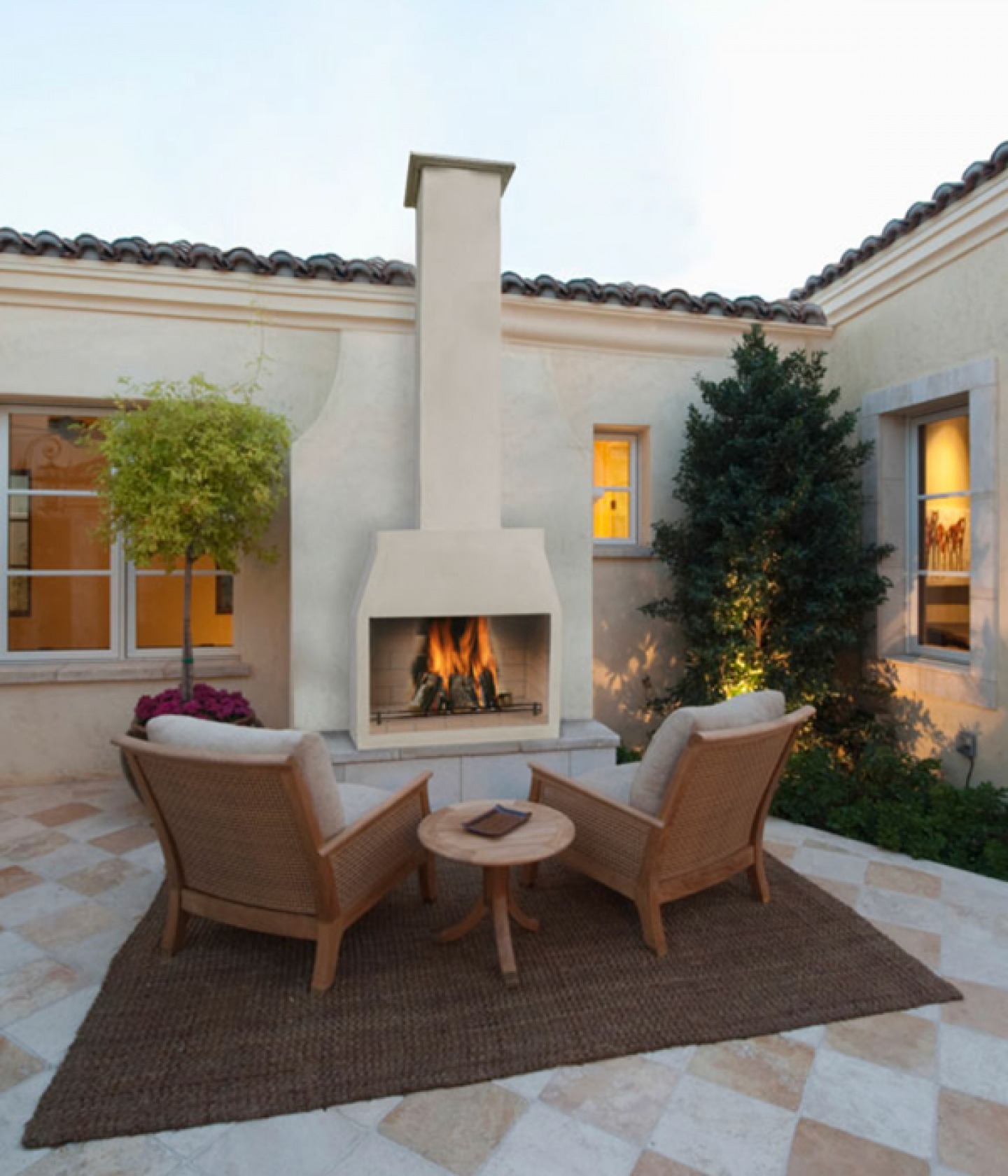 Outdoor seating in front of a large open fire | Stovesrus