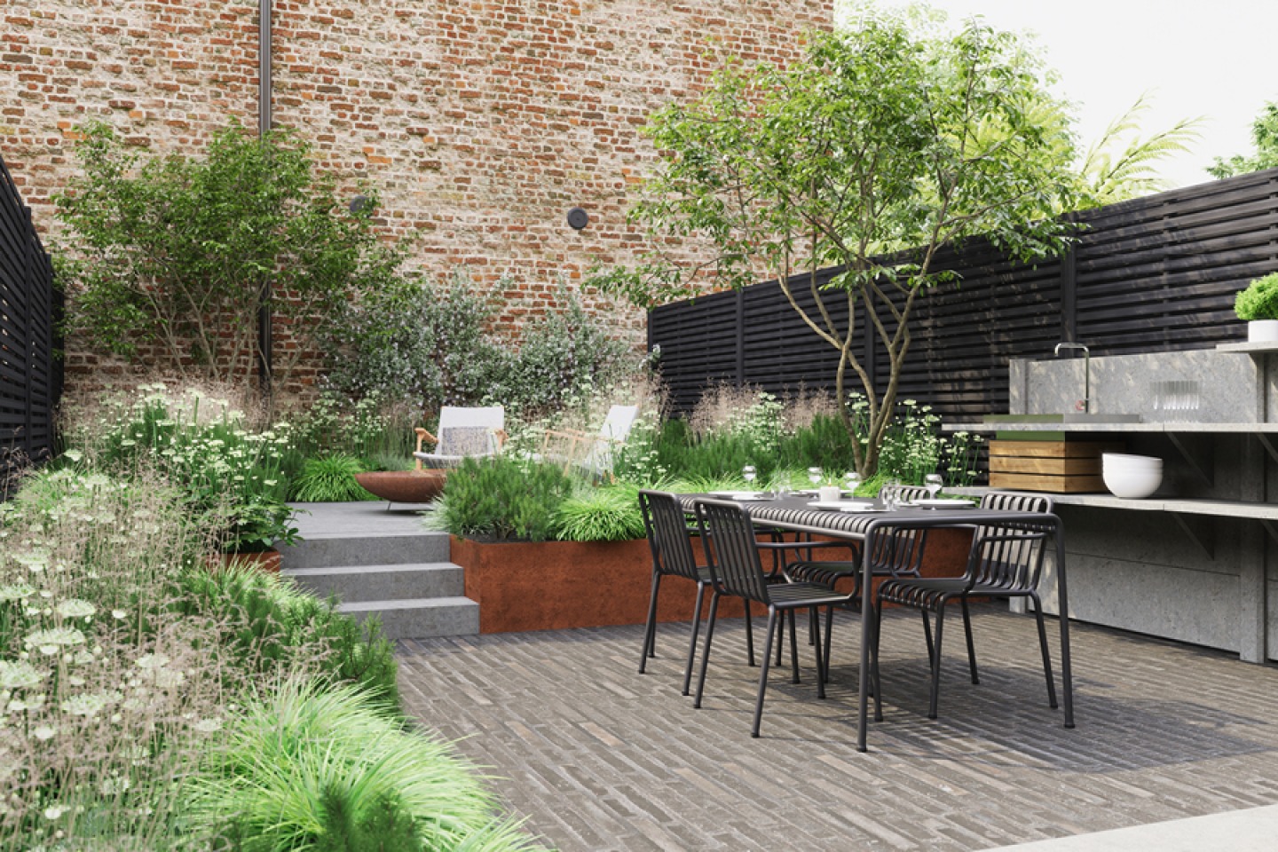 Outdoor dining and food prep area with built up seating surrounded by greenery | Soto Green