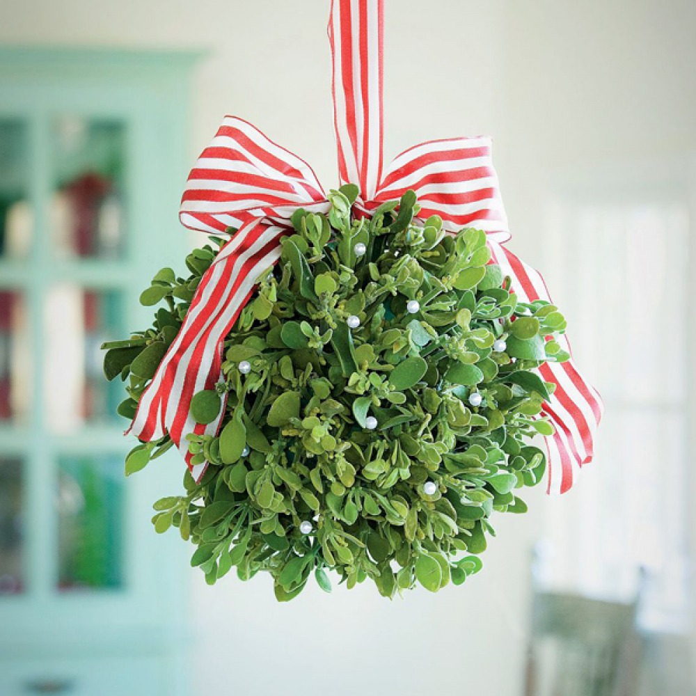decorative mistletoe ball with red and white bow ribbon