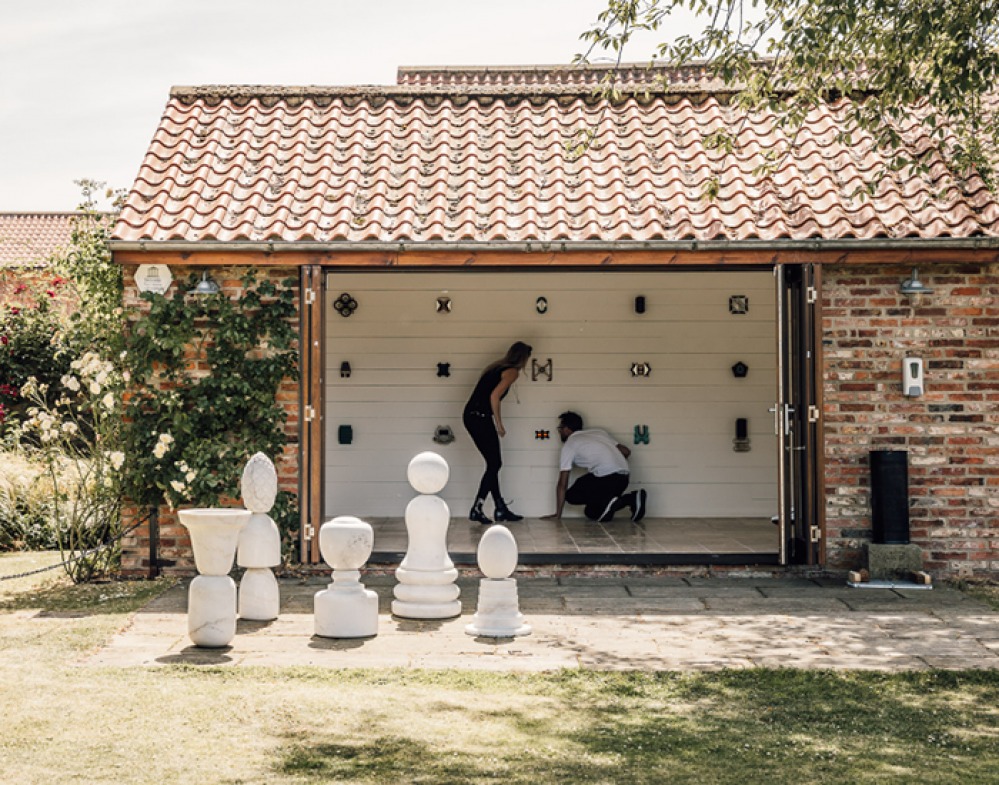 Willoughby Gerrish and Georgie Gerrish in The Orangery at Thirsk Hall Sculpture Garden. (Marble sculptures by Rob Ward & Sculpture in The Orangery by Jon Kipps) credit Joe Lang