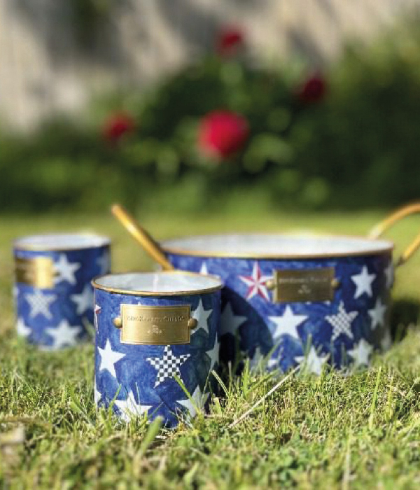 citronella candle decorated in a blue and white star pattern container